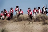 Red coats appearing over the hill