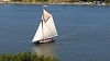 The sloop Clearwater is a restored river cargo ship that typically sailed the Hudson River in the 18th and 19th centuries. Folk singer Pete Seeger founded and restored the Clearwater as an environmental classroom that still sails the Hudson from New York City to Albany from April to October. It sails past my house often every summer and berths for awhile just across the river from me. Historically these ships sailed supplies from NYC to upstate New York -- eventually loaded on barges on the Erie Canal to be shipped to western New York State. You can still book rides on the Clearwater today. I've also enclosed photos from the restoration of the ship. Also enclosed is a picture of a sister ship the schooner Mystic Whaler which sails with the Clearwater in the summers.